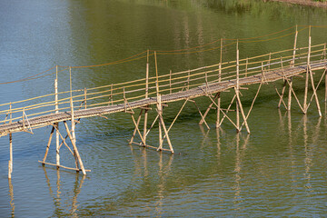 Tourist attraction place, The bamboo wooden bridge across the Namkhan River, Kingkitsarath Road, Luang Prabang, Laos.