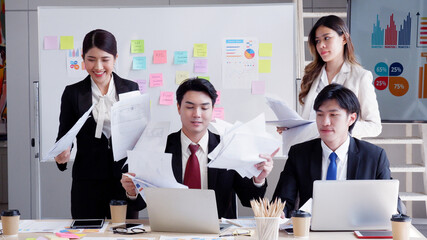 Employees work a lot table full of documents stress from work.