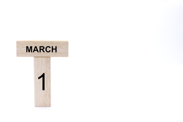 March 1 displayed wooden letter blocks on white background with space for print. Concept for calendar, reminder, date. 