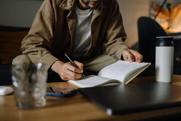 Image of businessman working at work table. Checklist writing planning investigate enthusiastic concept.