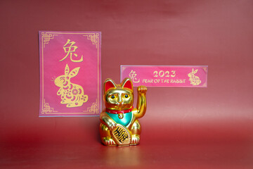 Celebration  Chinese new year 2023 year  of the  Rabbit  with  Maneki Neko waving  lucky  cat