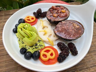 Mashed avocado with mixed multi grain and fruits