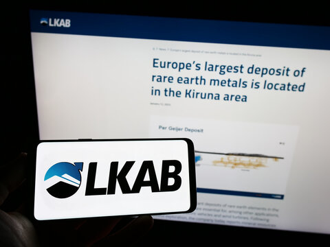 Stuttgart, Germany - 01-12-2023: Person holding cellphone with logo of company Luossavaara-Kiirunavaara AB (LKAB) on screen in front of business webpage. Focus on phone display.