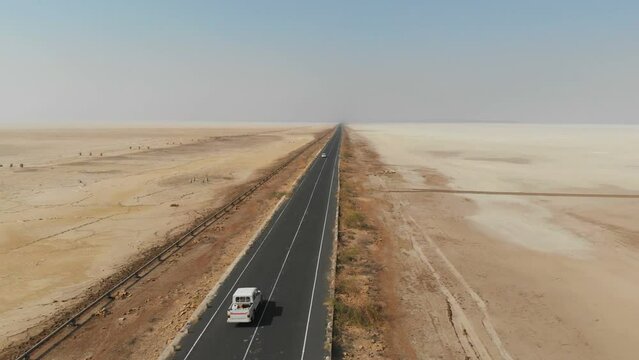 Driving on the highway of great rann of kutch. Beautiful white rann