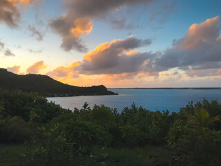 Tropical colorful sunset over sea lagoon island bay. Colorful cloudy sky. Scenic image of...