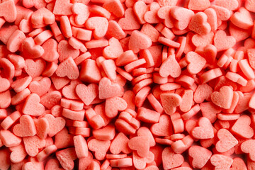 Sugar, pink hearts texture. Love concept. Selective focus.