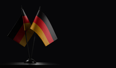 Small national flags of the Germany on a black background