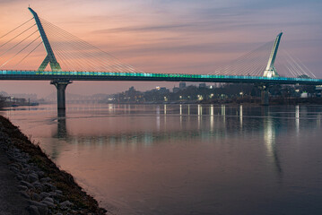 View of the sunrise bridge at Dongchon Amusement Park in Daegu just before sunrise