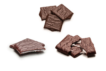 Dark chocolate candies isolated on white background.