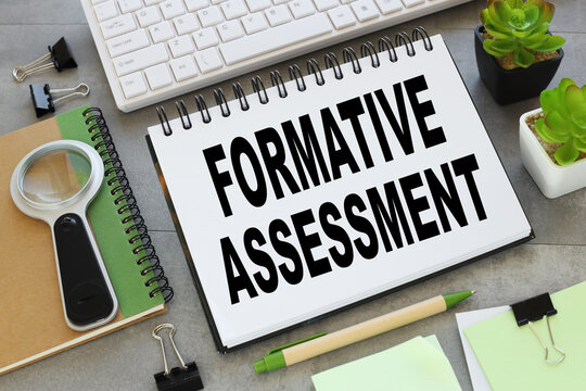 Formative Assessment top view of text near white keyboard.