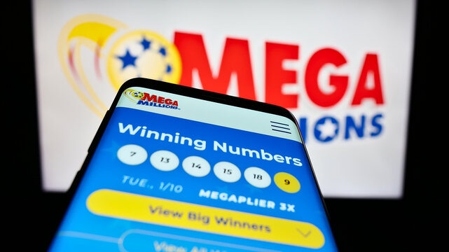 Stuttgart, Germany - 01-13-2023: Smartphone with website of US lottery game Mega Millions on screen in front of logo. Focus on top-left of phone display.