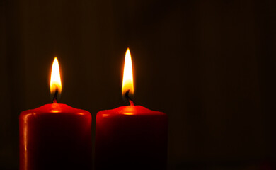 red candle in the dark. Candle. 