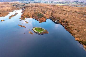 Fototapeta premium Aerial view of Lough Doon between Portnoo and Ardara which is famous for the medieval fort - County Donegal - Ireland.