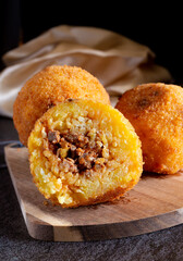 Fried stuffed Sicilian arancini with breadcrumbs crust