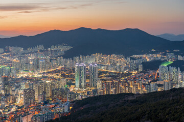 Panoramic and Night view of apartments and high-rise buildings at downtown Busan seen from Hwangnyeongsan Mountain in Winter
