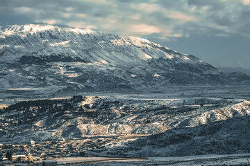 Winter landscape, covered with snow. Panorama of Gjirokastër (Gjirokaster), Albania, with the...