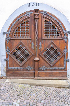 Old door of a historical building with steel door fittings