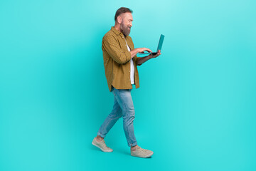 Profile side photo of successful man professional it specialist work office modern gadget empty space isolated on cyan color background