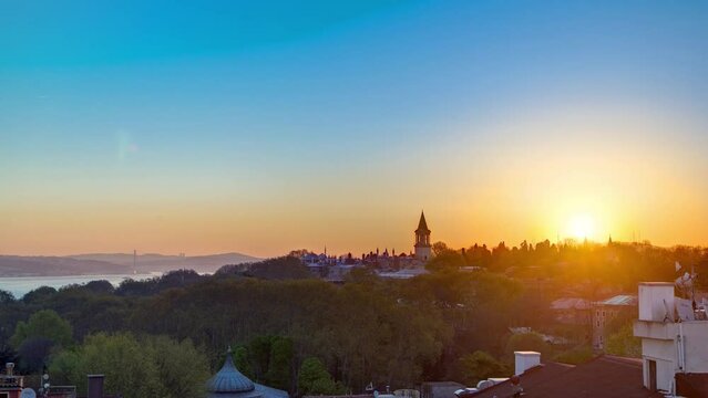 Beautiful Sunrise over Istanbul from top with Bosphorus Bridge and Topkapi Palace Museum timelapse. Istanbul - Turkey. Aerial view from sultanahmet downtown at clear spring morning