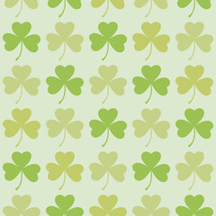 Fototapeta premium Saint Patrick's Day greetings with tree leaf clovers on green background.