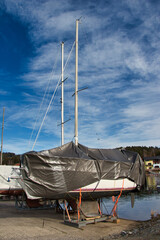 Yachts  wrapped up for winter storage, Lipno marina. Czech Republic.