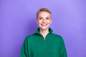 Photo of beautiful pretty smiling lady wear green zipper pullover looking up mockup open new brand shop discount isolated on purple color background © deagreez