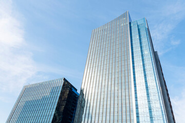 Fototapeta na wymiar skyscraper against sky building glass background. Modern urban architecture.