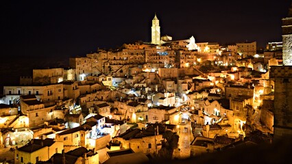 Obraz premium night landscape of the famous Sassi di Matera carved into the rock in Basilicata, Italy