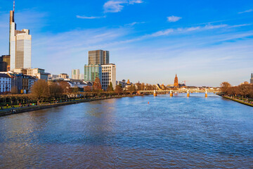 Obraz premium View across the Main towards the skyline of Frankfurt am Main on a sunny spring day