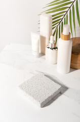 Cosmetic beauty product presentation scene made with pumice stone pedestal on a bathroom shelf....