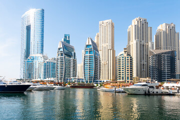 Fototapeta na wymiar Dubai Marina skyscrapers, port with luxury yachts and Marina promenade, Dubai, United Arab Emirates