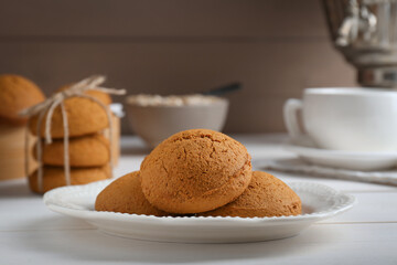Delicious oatmeal cookies on white wooden table, closeup