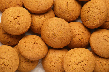Many delicious oatmeal cookies as background, top view