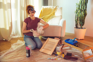 Cute ginger girl conducting an online tutorial on wood painting