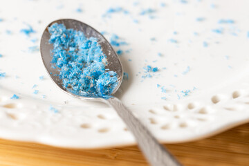 Microplastic in food, Environment and health concept, spoon and plate with plastic particles, Effect of environmental pollution on health