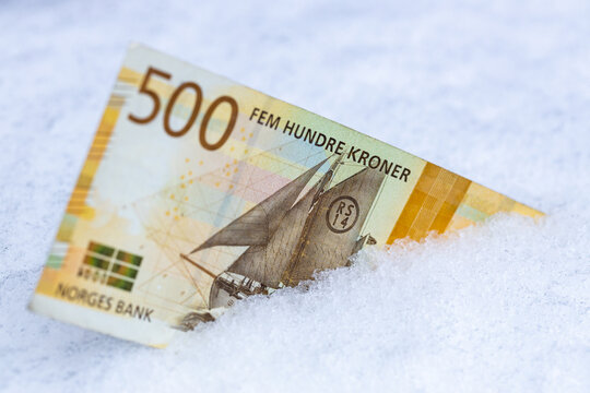 Norwegian 500 Crowns Lying In The Snow, Financial Concept, Spending Freeze