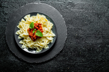 Pasta Farfalle with Bolognese sauce on a plate.