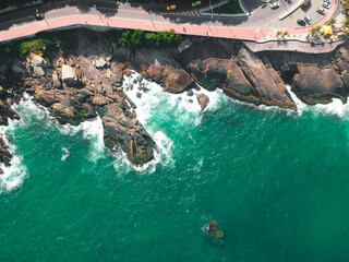 High-angle view of rocks in a blue ocean