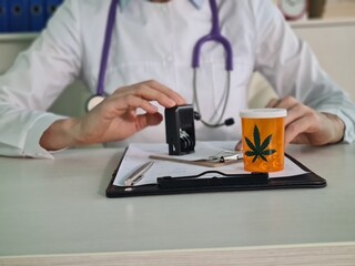 Doctor writes prescription for marijuana to patient and stamps it