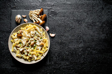 Fusilli pasta with mushrooms and garlic.