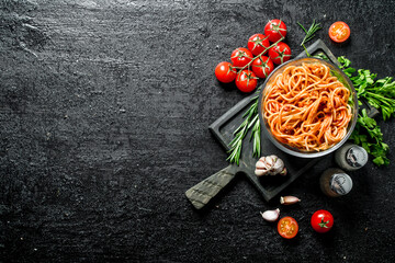 Pasta in a bowl with tomatoes,herbs and garlic.