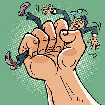 A mans fist squeezes a businessmans man. Pressure stress, politics and dictatorship concept