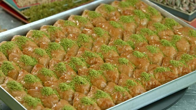 Traditional turkish baklava pistachio pastry. Dilberdudagi, ozel kesim baklava, cikolatali baklava, fistikli baklava, katmer, fistikli kadayif, kattafi, fistik sarma, soguk baklava, midye baklava, cev