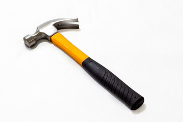 black and yellow hammer on white background