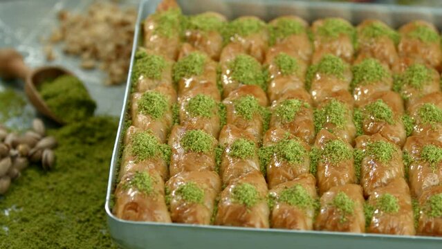 Traditional turkish baklava pistachio pastry. Dilberdudagi, ozel kesim baklava, cikolatali baklava, fistikli baklava, katmer, fistikli kadayif, kattafi, fistik sarma, soguk baklava, midye baklava, cev