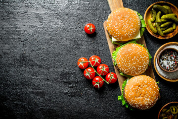Burgers with juicy cutlet of beef and beer in a glass.
