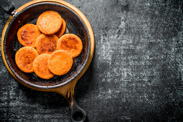 Fish cutlets in pan.