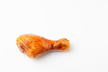 Roasted chicken drumsticks on white background, top view