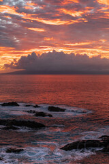 Obraz premium Sunset over the ocean and La Gomera island, one of Spain's Canary Islands