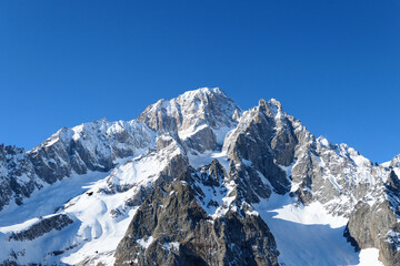 Fototapeta na wymiar Mont Blanc mountain view from piste in Courmayeur ski resort. Italian Alps, Aosta Valley.